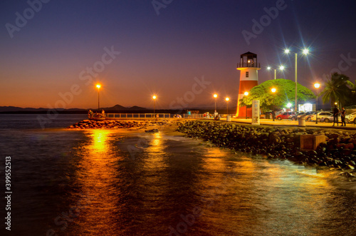 Lighthouse and Dock with some rocks in Puntarenas Costa Rica
