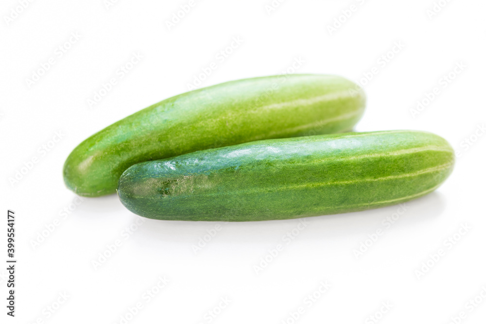 Green cucumber on white background, fresh vegetable, healthy diet food, salad ingredient Green cucumber on white background, fresh vegetable, healthy diet food, salad ingredient