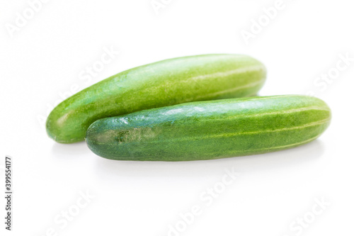 Green cucumber on white background, fresh vegetable, healthy diet food, salad ingredient