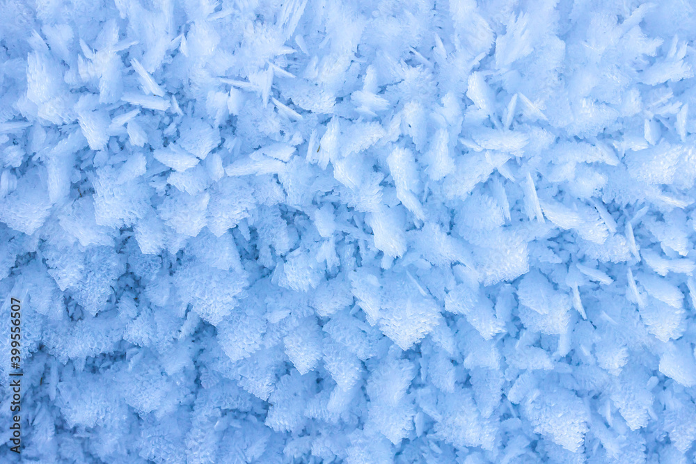 Fototapeta premium Blue snow crystals texture winter natural background