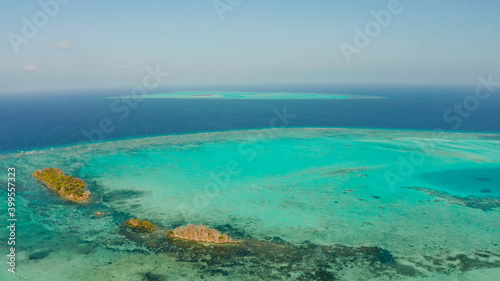 Tropical islands surrounded by an atoll and a coral reef view from above. Balabac, Philippines. Summer and travel vacation concept