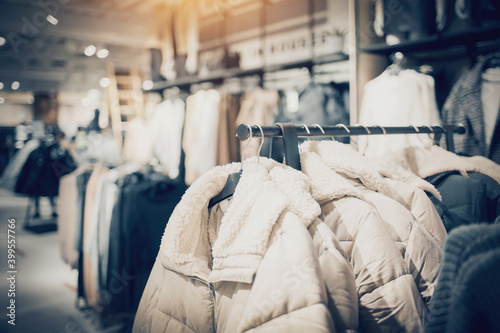 Shopping in store. Clothes on hangers in shop for sale