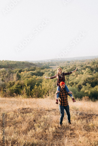 Cheerful guy and girl on a walk in bright knitted hats