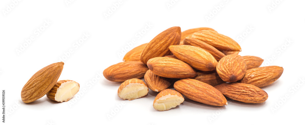 Heap of almond nuts isolated on white background