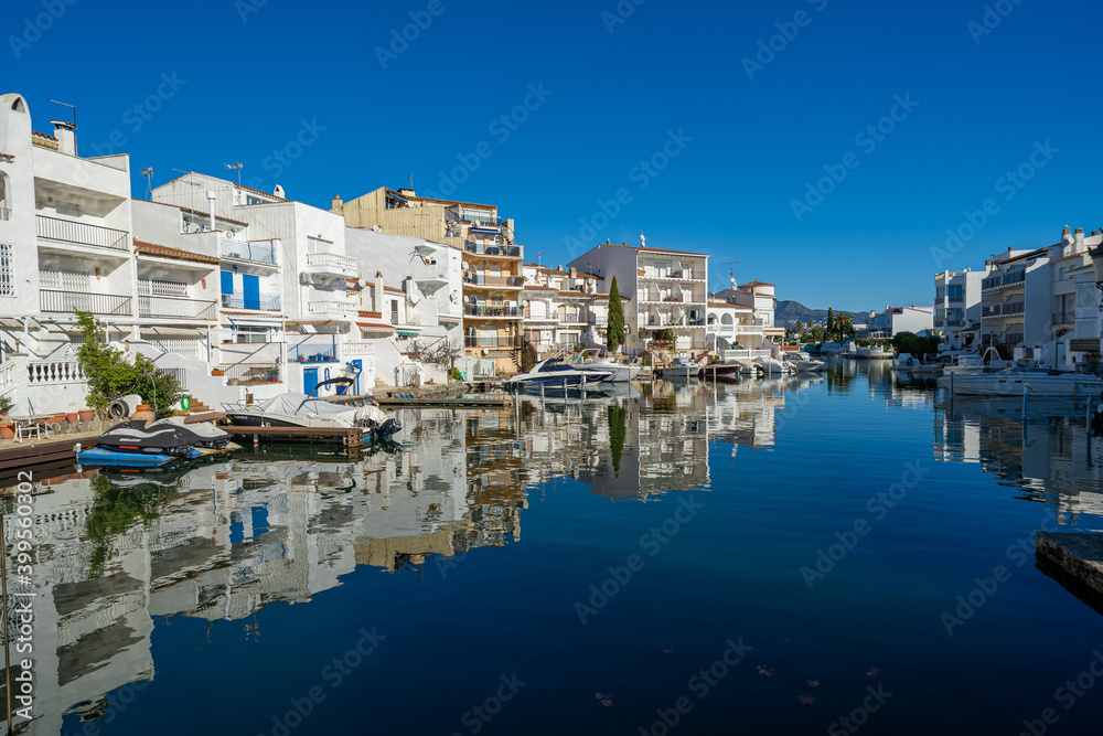 empuriabrava girona view of the canals buildings reflected in the water catalunya europe tourism spain