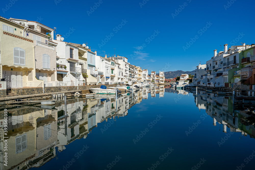 empuriabrava girona view of the canals buildings reflected in the water catalunya europe tourism spain