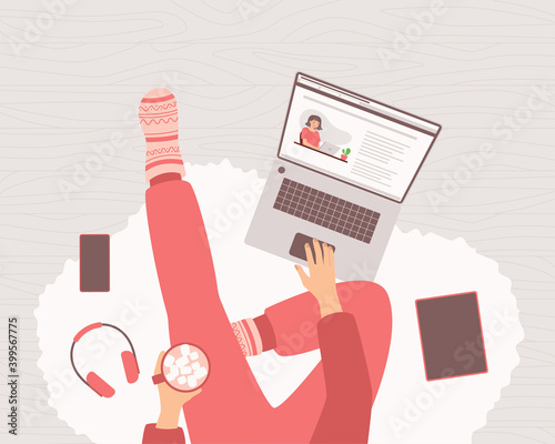 Freelancer woman in home pants and warm socks sits with a laptop and cocoa on the floor. Concept of remote work from home, programming, e-learning, blogging. Home office top view. Vector illustration