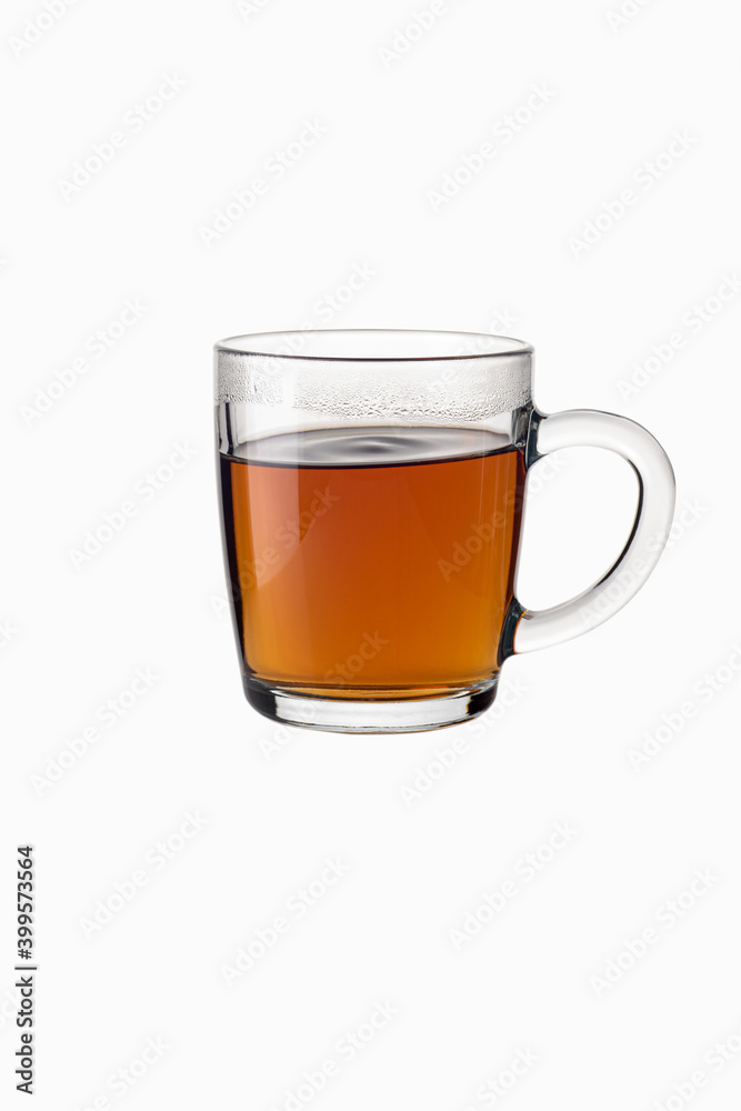 Tea in a transparent glass mug on a white background Tea in a transparent glass mug on a white background