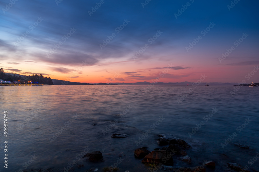 Sunset or dusk at Port Hardy, BC with Johnstone Strait in the background on Vancouver Island Sunset or dusk at Port Hardy, BC with Johnstone Strait in the background on Vancouver Island