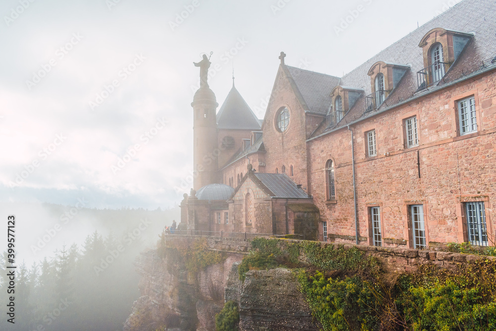 Sanctuary Mount Sainte-Odile (Mont Sainte-Odile) with fog, located in Ottrott in the Bas-Rhin department,