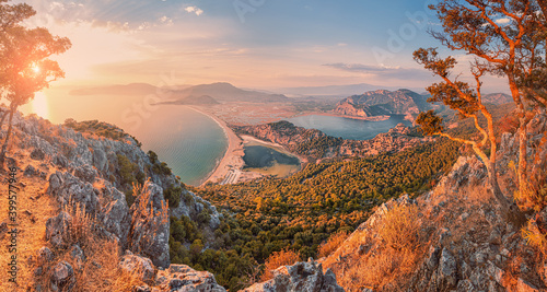 Fototapeta Naklejka Na Ścianę i Meble -  Stunning panoramic view from the top of the mountain to the blue bay and lagoon near the town of Dalyan in Turkey. Famous Mediterranean resorts and the wonders of nature