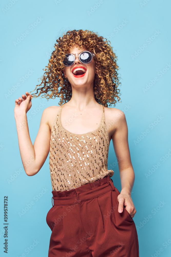 Portrait of a woman Curly hair fun fashion cropped look red lips