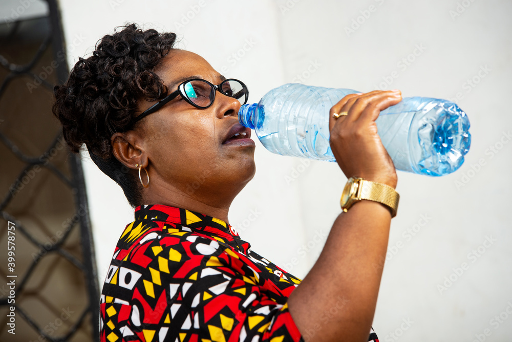 close-up of a beautiful woman drinking water close-up of a beautiful woman drinking water