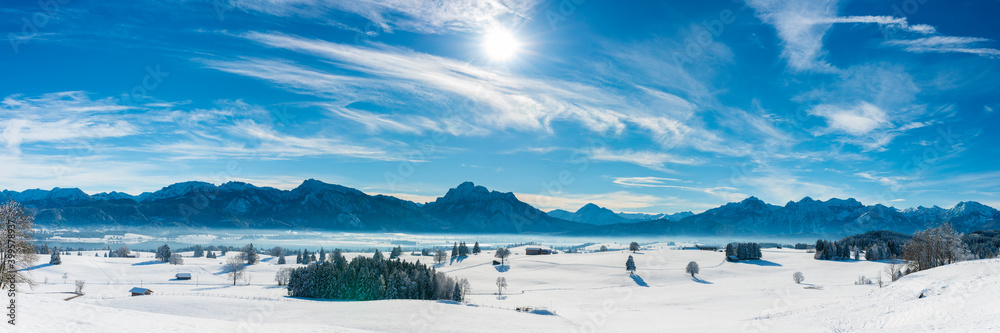 panoramic winter landscape in Germany, Bavaria, and alps mountain range panoramic winter landscape in Germany, Bavaria, and alps mountain range