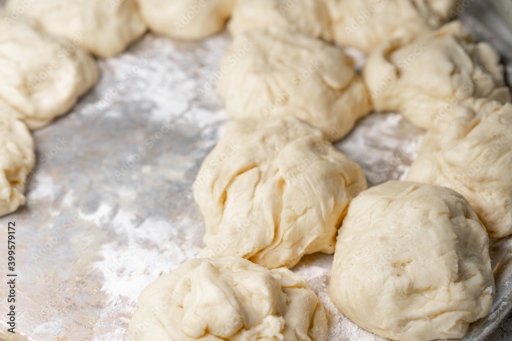 Dough pieces in flour for baking Dough pieces in flour for baking