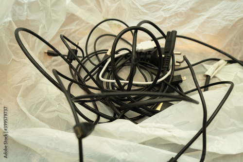 Tangled wires and cords for charging and re-washing devices. Keeping cables.