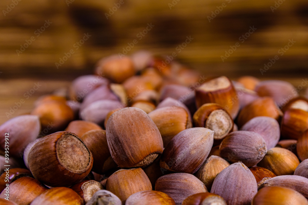 Pile of the hazelnuts on wooden table