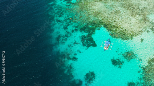 Turquoise lagoon surface on atoll and coral reef  copy space for text. Top view transparent turquoise ocean water surface. background texture