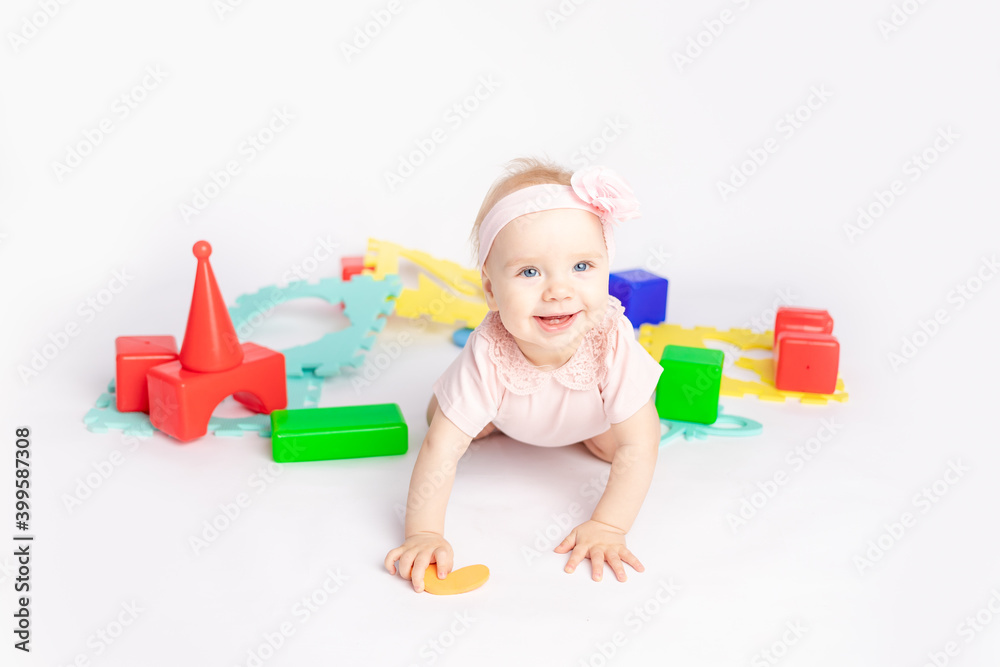 the kid plays with cubes on a white isolated background, space for text the kid plays with cubes on a white isolated background, space for text