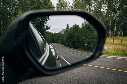Reflection of the road in rearview mirror