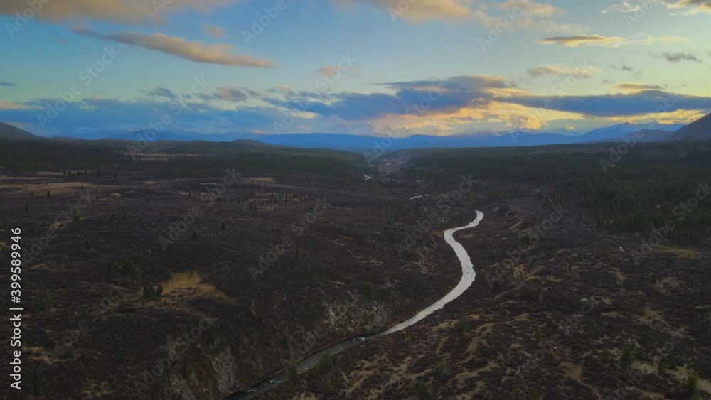 O'Donnell River twisting along green forest landscape. Aerial establishing shot O'Donnell River twisting along green forest landscape. Aerial establishing shot