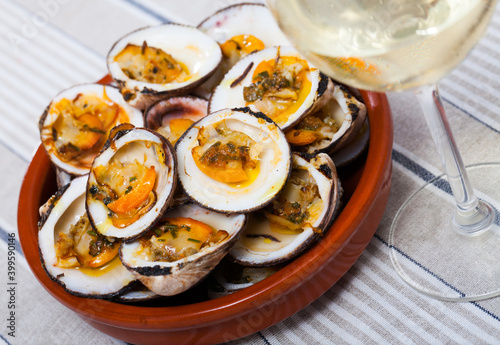 Delicious baked in oven Dog cockles (bivalve shellfishes) served in bowl