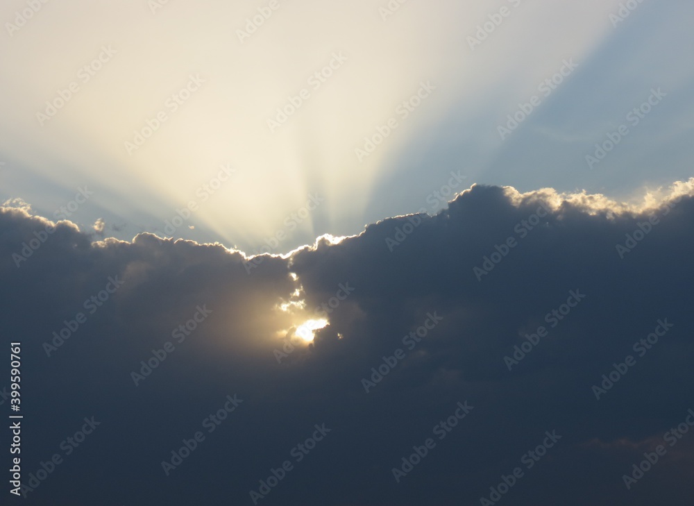 sun between clouds sun between clouds