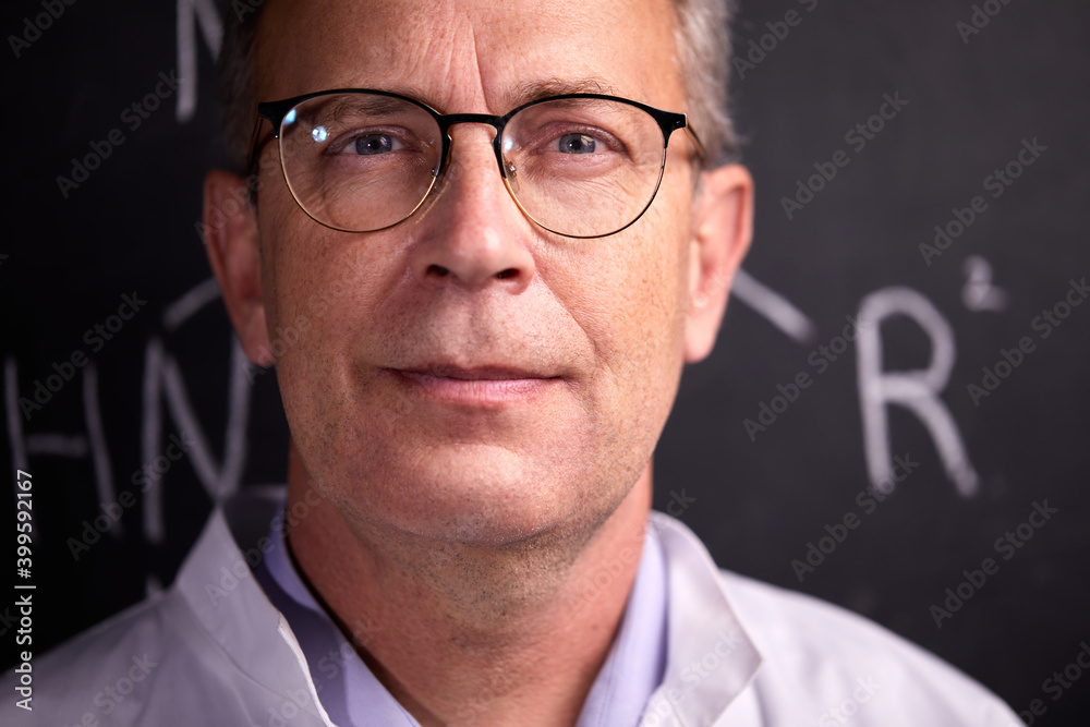 confident professor scientist in spectacles having deep intelligent gaze, looks at camera. chemist knows his work confident professor scientist in spectacles having deep intelligent gaze, looks at camera. chemist knows his work