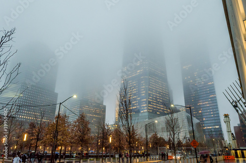 Low Angle View of Lower Manhattan Skyscrapers on a Foggy Night in New York City, USA