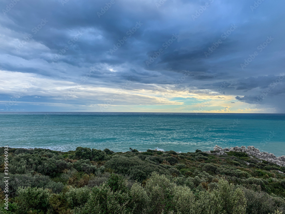 Stormy cloudy weather at the sea, azure water, seascape background