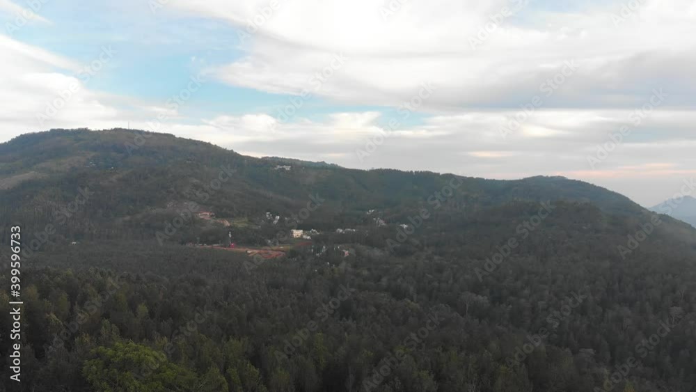 Aerial wide shot of a green forest on top of a hill in Yercaud on a summer day, conservation concept Aerial wide shot of a green forest on top of a hill in Yercaud on a summer day, conservation concept