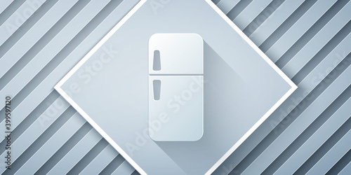 Paper cut Refrigerator icon isolated on grey background. Fridge freezer refrigerator. Household tech and appliances. Paper art style. Vector.