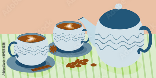 A set of blue dishes on the table. Teapot and coffee cups