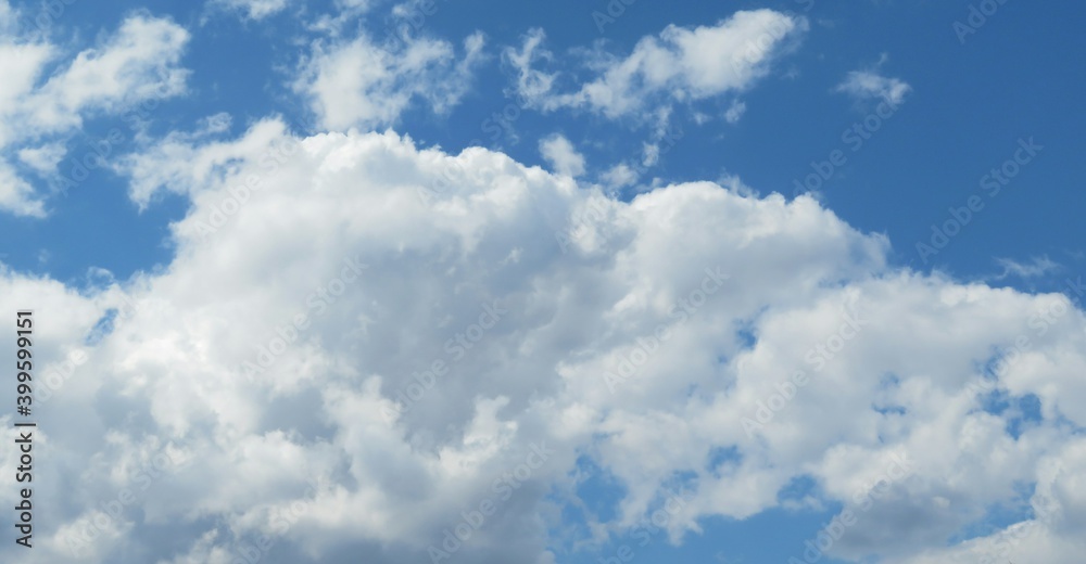 Panoramic view of blue sky with fluffy clouds Panoramic view of blue sky with fluffy clouds