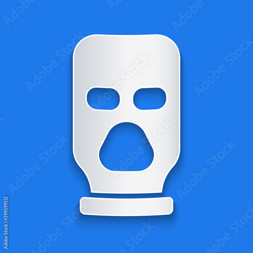 Paper cut Balaclava icon isolated on blue background. A piece of clothing for winter sports or a mask for a criminal or a thief. Paper art style. Vector.