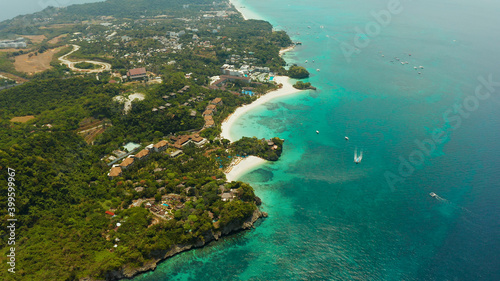 Shore of the tropical island of Boracay with sandy beaches and hotels from above. Summer and travel vacation concept. Philippines.