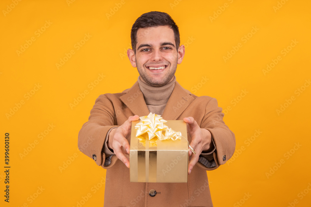 attractive young man with gift box isolated attractive young man with gift box isolated