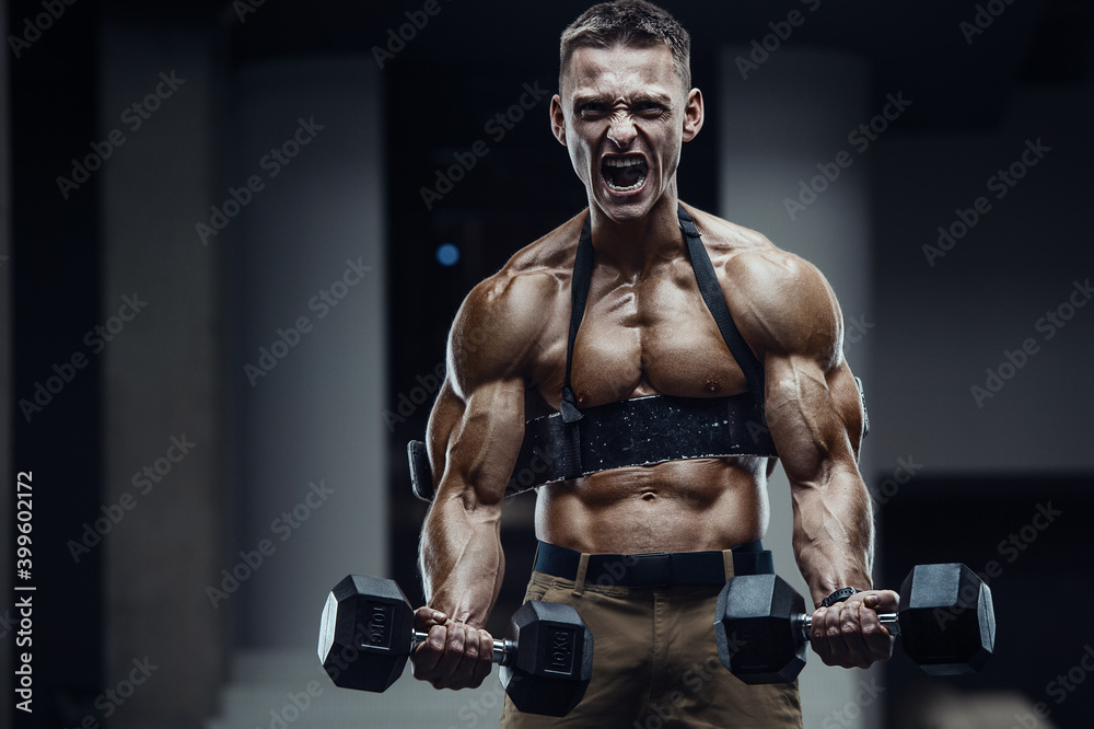 Energy caucasian strong athlete screaming in gym