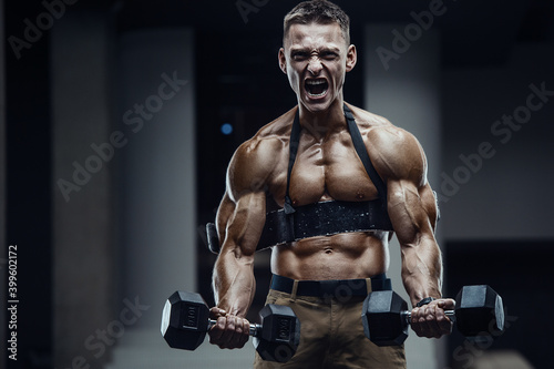 Energy caucasian strong athlete screaming in gym © antondotsenko