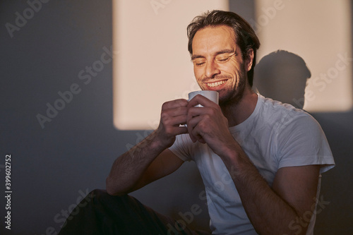 Young single man enjoying his morning coffee