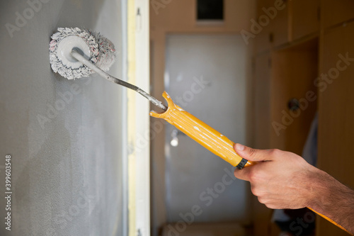 Man painting his walls photo