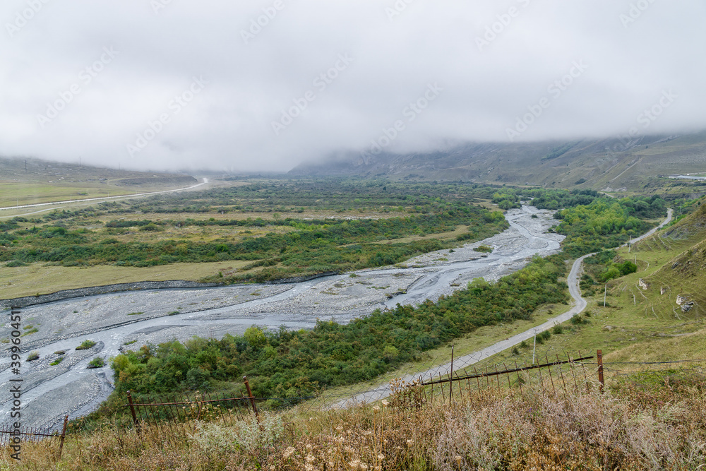 Naklejka premium Cloudy view of ancient Alanian necropolis (the City of the Dead) of Dargavs village in North Osetia Alania, North Caucasus, Russia