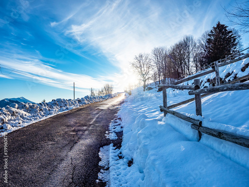 Alpine road in a winter morning photo