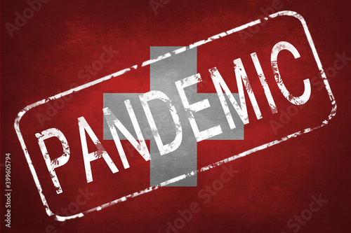 The stamp "PANDEMIC" against the background of the flag of Switzerland. Quarantine during the COVID-19 coronavirus pandemic in Switzerland. Anti-epidemic quarantine measures.