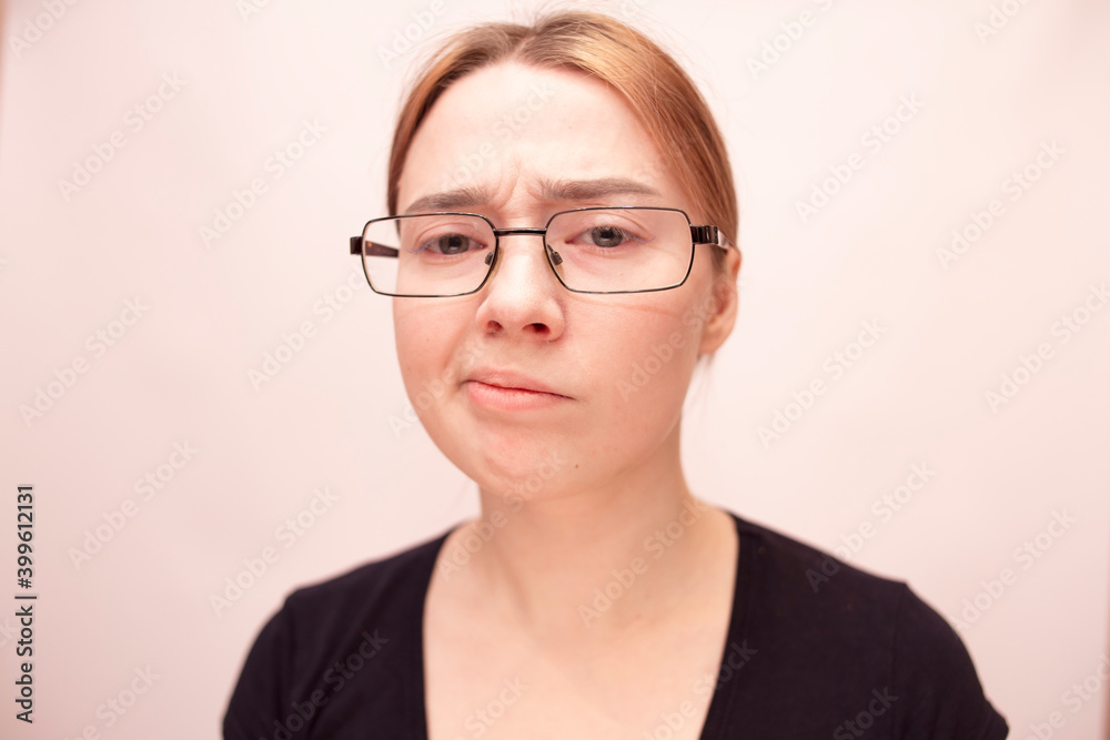 
Young girl with glasses on a white background
