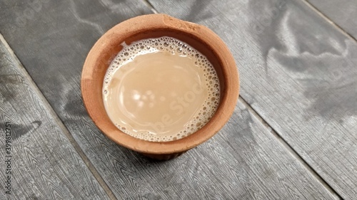 A kulhar or kulhad cup (traditional handle-less clay cup) from North India filled with hot Indian tea