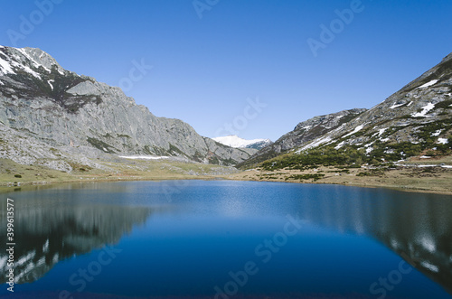 Lake Isoba  Leon. Spain. Mountain landscape with lake and snowy mountains.