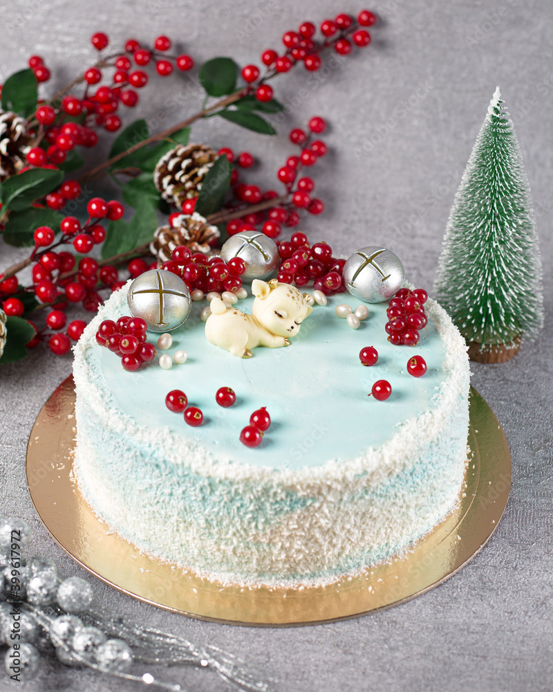 Festive Christmas cake with a figure of a deer Festive Christmas cake with a figure of a deer
