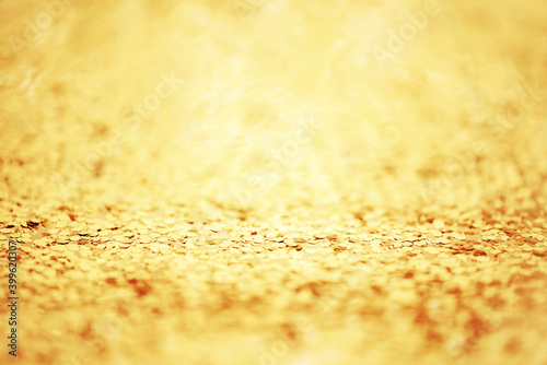 Golden festive background with glitter