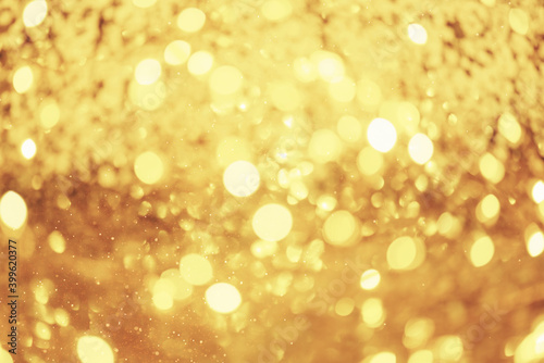 Golden festive background with glitter and lights